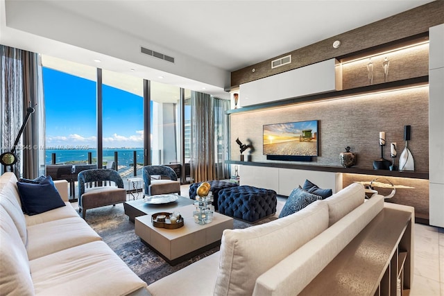 living room featuring expansive windows and visible vents