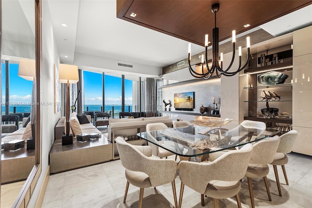 dining area featuring a chandelier, recessed lighting, and visible vents