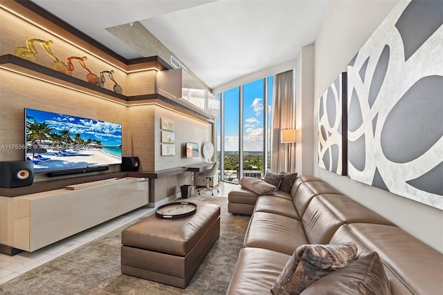 living area with a wall of windows and tile patterned floors