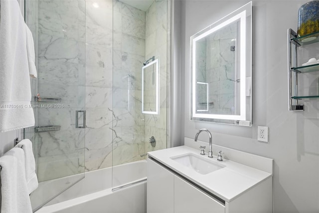 bathroom with enclosed tub / shower combo and vanity