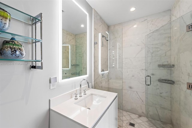 full bathroom featuring a stall shower, vanity, and recessed lighting