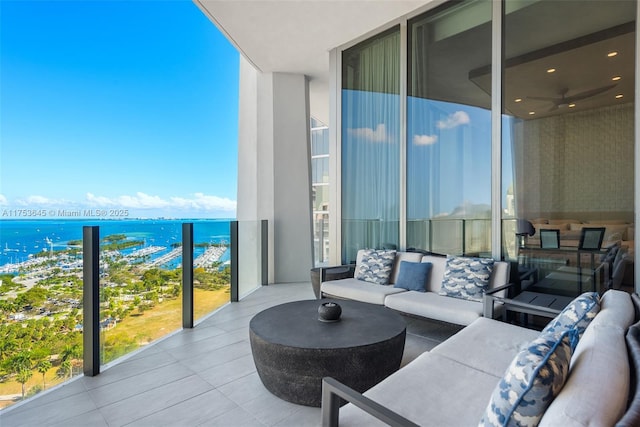 balcony featuring an outdoor hangout area and a water view