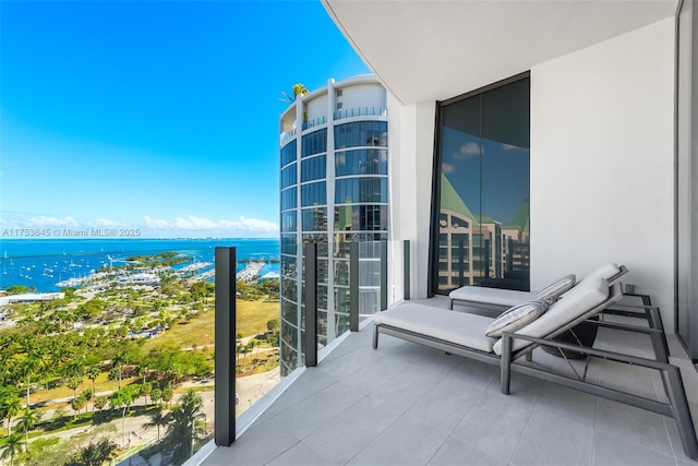 balcony featuring a water view