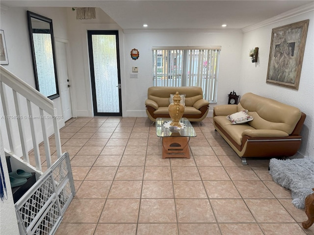 living room with light tile patterned floors, ornamental molding, stairway, and recessed lighting