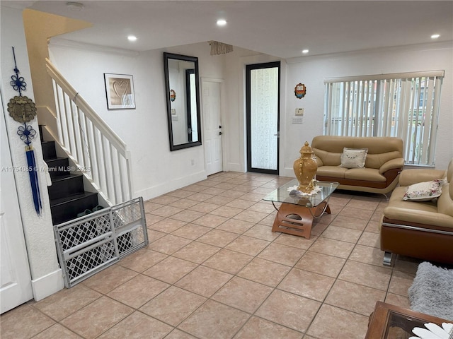 living area with light tile patterned floors, baseboards, stairway, and recessed lighting
