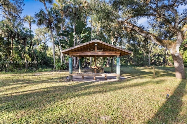 view of home's community with a lawn and a gazebo