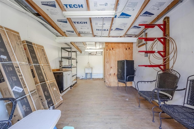 basement featuring wood finished floors