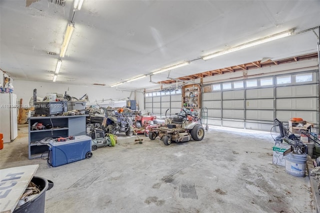 garage with freestanding refrigerator