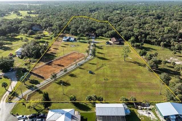 aerial view with a rural view and a view of trees