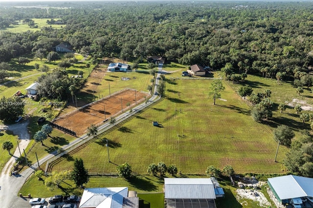 bird's eye view with a rural view and a wooded view