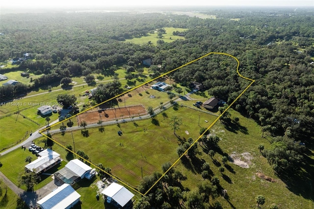 aerial view with a rural view and a wooded view