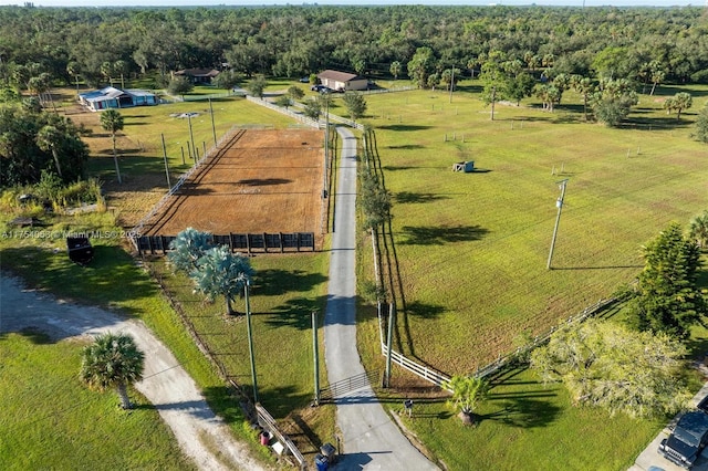 drone / aerial view featuring a forest view and a rural view