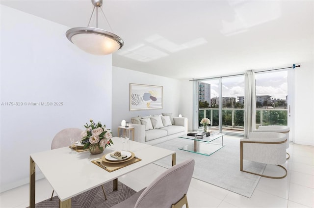 living room featuring floor to ceiling windows