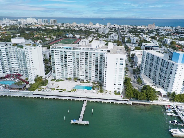 aerial view featuring a view of city and a water view