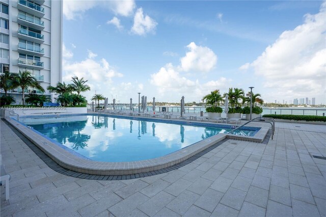 community pool featuring a patio area