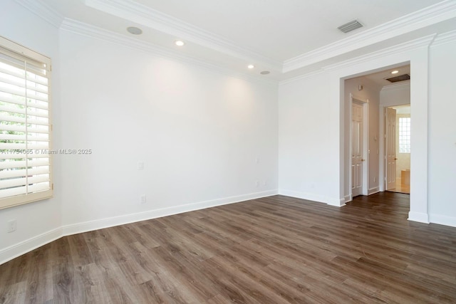 unfurnished room with visible vents, baseboards, ornamental molding, wood finished floors, and recessed lighting
