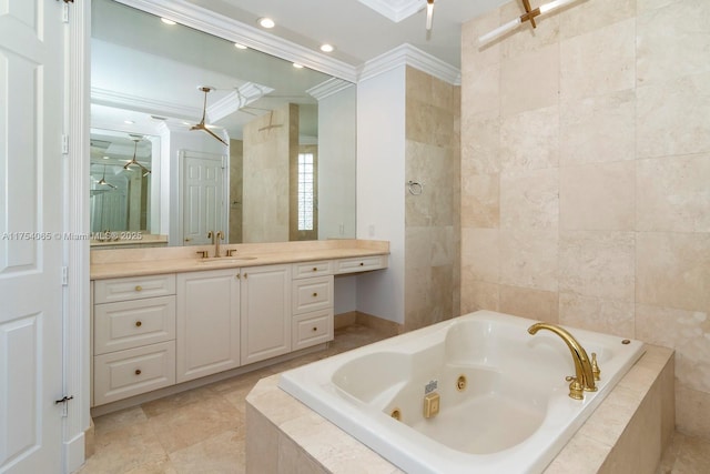 full bathroom featuring vanity, a whirlpool tub, tile patterned flooring, ornamental molding, and tile walls