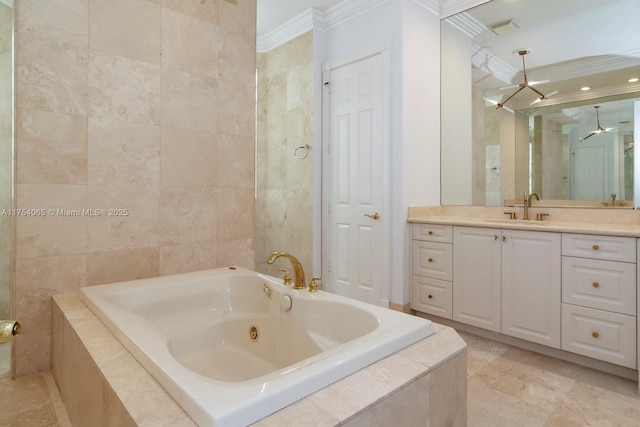 bathroom featuring tile walls, visible vents, ornamental molding, vanity, and a whirlpool tub