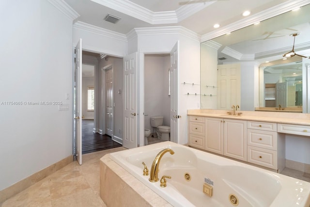 bathroom with toilet, a tub with jets, baseboards, visible vents, and ornamental molding