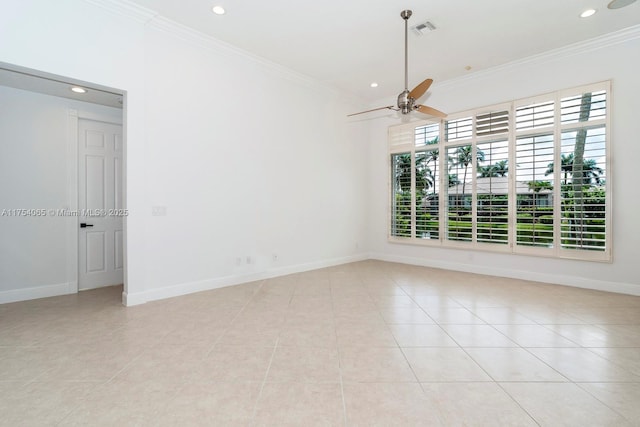 spare room featuring baseboards, ornamental molding, visible vents, and a ceiling fan