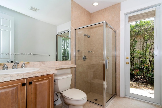 bathroom with visible vents, tile patterned floors, toilet, and a shower stall