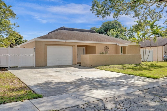 single story home featuring a garage, concrete driveway, fence, and stucco siding