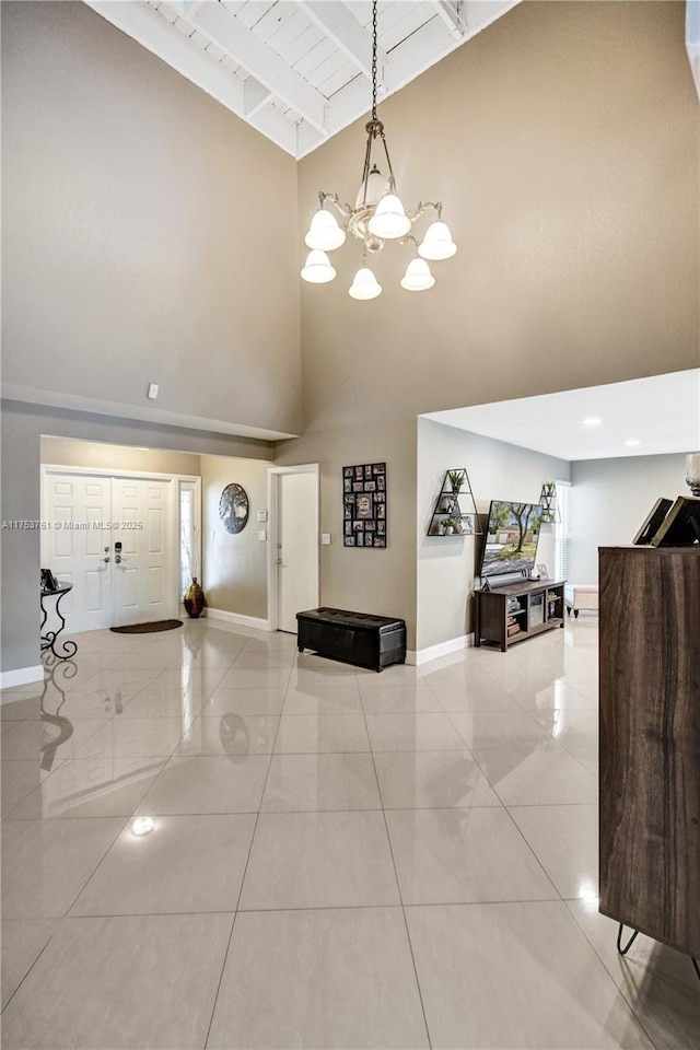 foyer entrance with baseboards and light tile patterned flooring