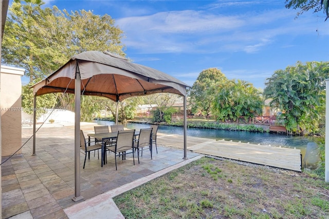 view of patio / terrace featuring a water view and a gazebo