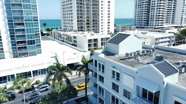 drone / aerial view with a water view and a city view