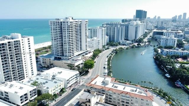 birds eye view of property featuring a view of city and a water view