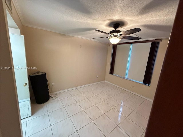 unfurnished room with light tile patterned floors, baseboards, ceiling fan, ornamental molding, and a textured ceiling