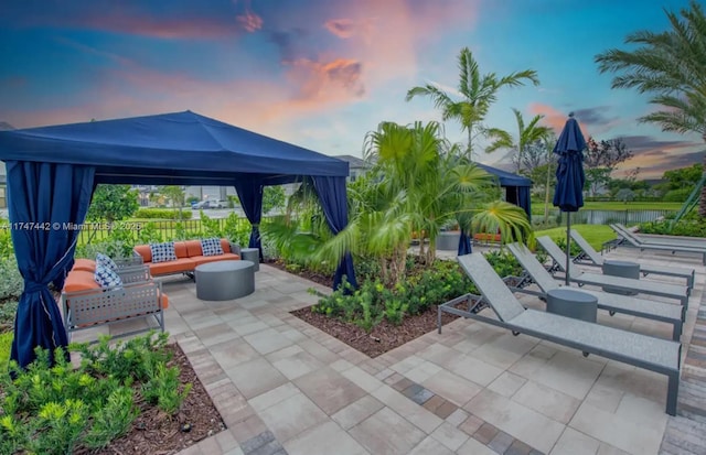 view of patio featuring a gazebo and an outdoor living space