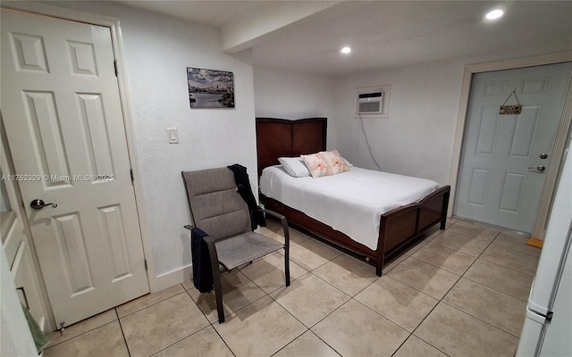 bedroom featuring an AC wall unit, light tile patterned flooring, and recessed lighting