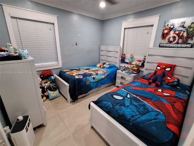 bedroom with ornamental molding, fridge, and light tile patterned floors