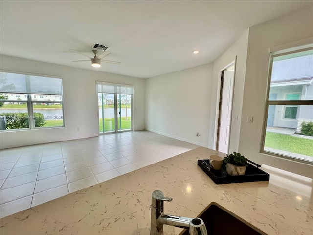 unfurnished living room featuring recessed lighting, visible vents, ceiling fan, and light tile patterned flooring