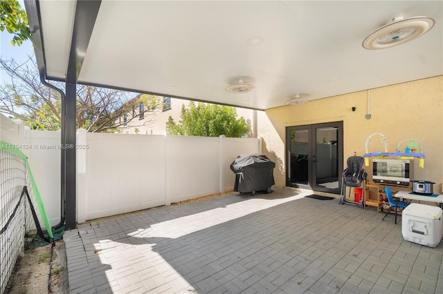 view of patio with a fenced backyard and area for grilling