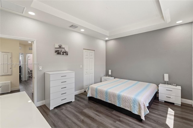 bedroom with recessed lighting, visible vents, and wood finished floors