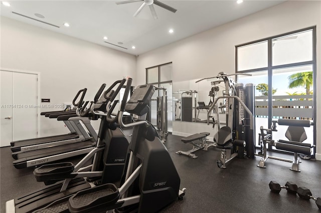 exercise room with a ceiling fan and recessed lighting