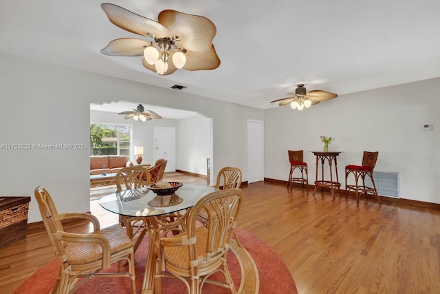 177 NE 109th St, Miami Shores, FL 33161 - dining area with wood finished floors, a ceiling fan, and baseboards