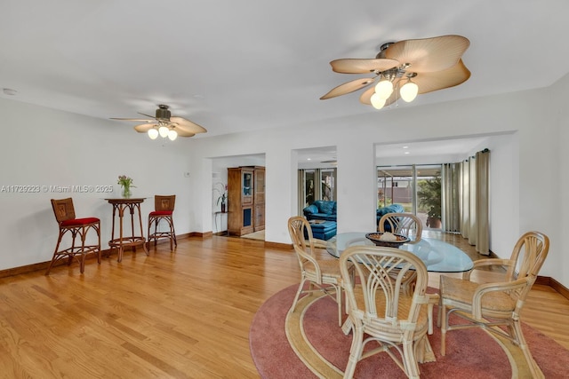 177 NE 109th St, Miami Shores, FL 33161 - dining area featuring a ceiling fan and light wood-style floors