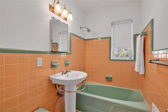 177 NE 109th St, Miami Shores, FL 33161 - bathroom featuring tile walls and tub / shower combination