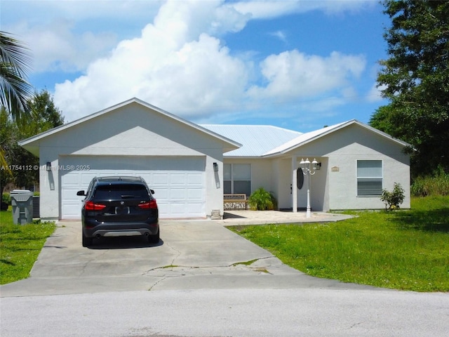 ranch-style house with a garage, driveway, a front lawn, and stucco siding