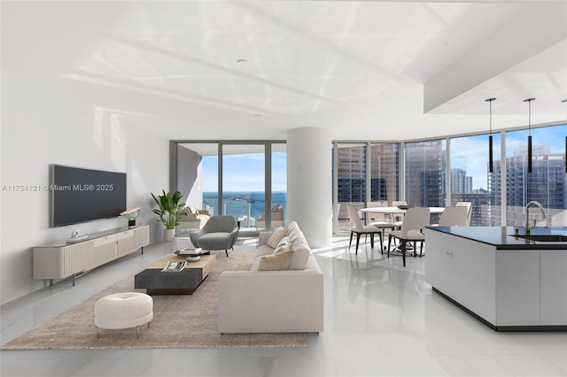 living area featuring floor to ceiling windows and a city view