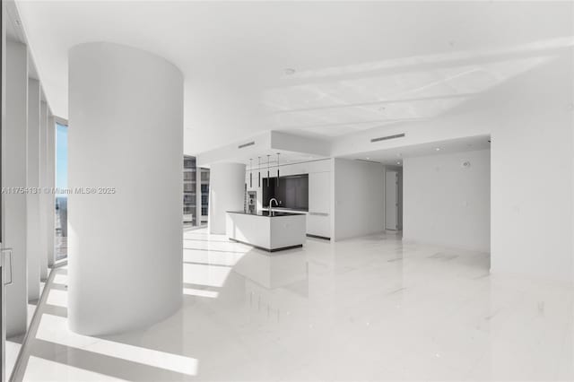 living room featuring marble finish floor and visible vents