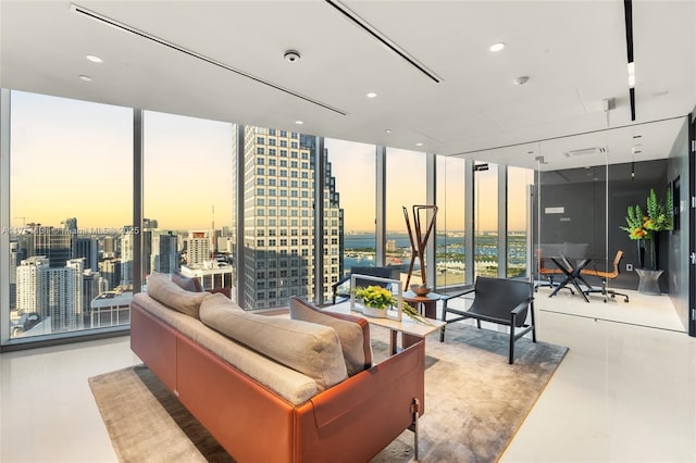 interior space featuring a view of city, floor to ceiling windows, and recessed lighting