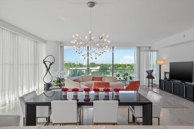 dining area featuring an inviting chandelier, plenty of natural light, concrete floors, and a wall of windows