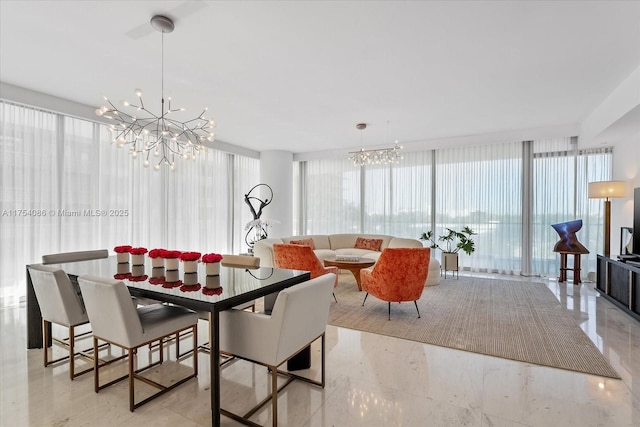 dining space featuring a chandelier and floor to ceiling windows