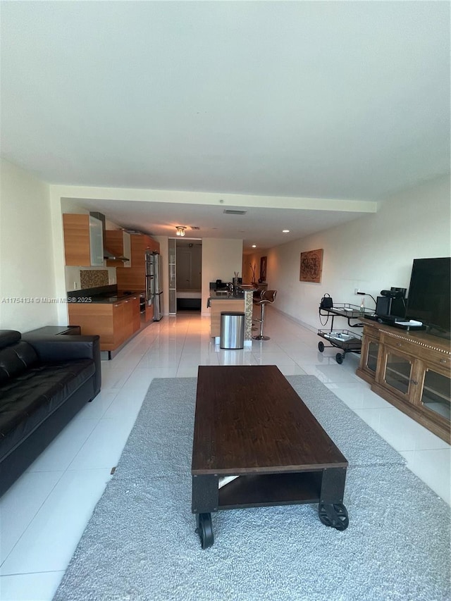 living area with light tile patterned floors