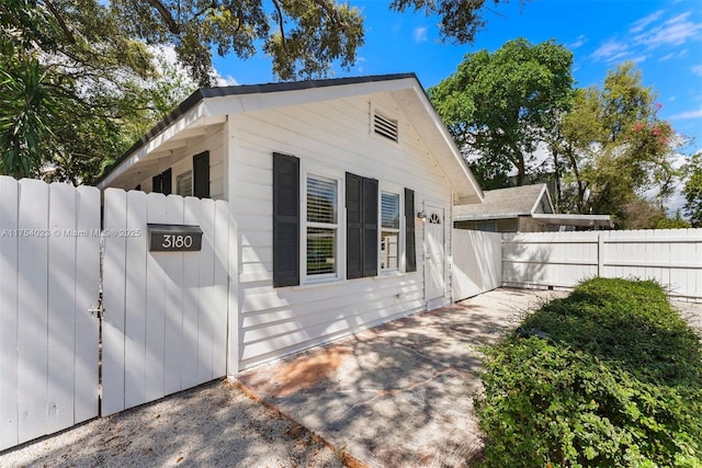 view of home's exterior featuring fence