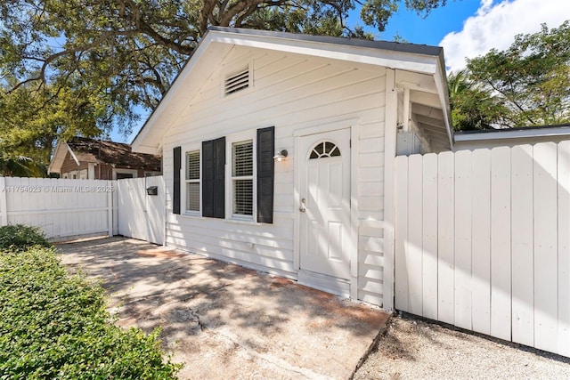 back of property featuring fence